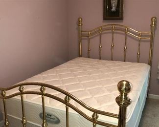 Full size brass bed has like new Beautyrest mattress and box springs