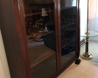 Two door 1890-1910 Mahogany empire bookcase or curio cabinet with wavy glass, one key for both doors, original finish, 