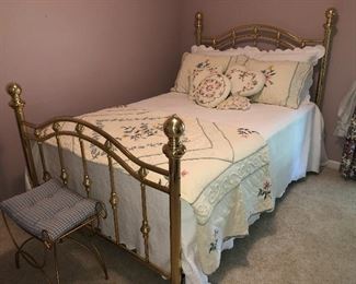 Full size brass bed with vintage quilted bedding, has like new Beautyrest mattress and box springs