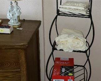black iron shelves with linens