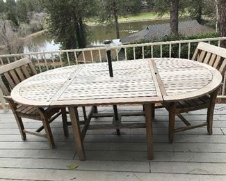 Teakwood oval patio table with 6 chairs