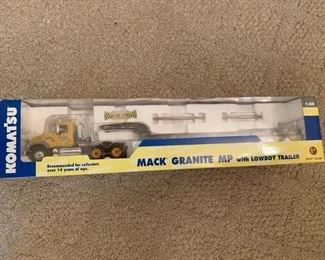 #58		Mack Granite P w/Lowboy Trailer   First Gear Komatsu	 $75.00 

