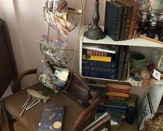 Cool corner in the bedroom. Lots of variety. Old vanity bench. Great books. Lots of sewing notions in the bags