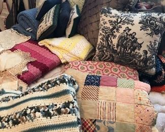 Cool old quilts and lots of hand knit afghans