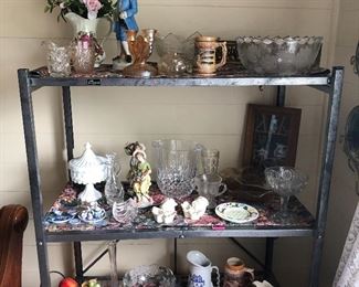 Check out the shelves. Porcelain and bisque. Milk glass. Sugar and creamers and a compote filled with fruit