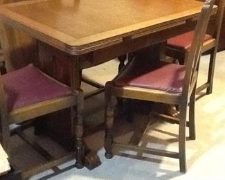 Kitchen tables with four chairs. The end caps slide out to extend the length of the table. This is a very unique kitchen set..