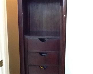 This is on of my favorite pieces. It's a lovely mahogany lingered chest with four drawers and an open shelf for some of your perfumes. It has a beautiful beveled glass mirrored door.