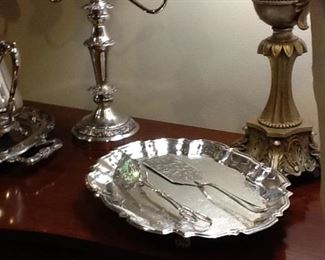 Lovely silver tray with serving utensils.
