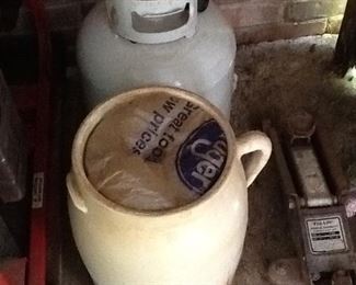 Lovely old churn and a propane gas tank