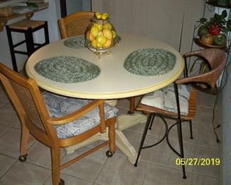 Pedestal Table, Metal and wood seat Chair, 2 Cane Back Chairs with casters.