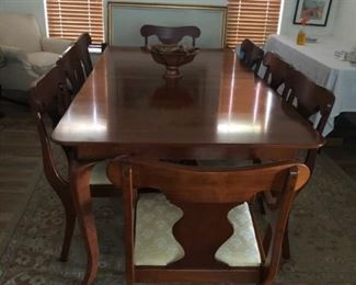 Magnificent eight chair Queen Anne style dining set with two leaves in near perfect condition.   