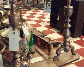 These fireplace andirons are BRASS and have grotesque heads and paw feet and they are huge.