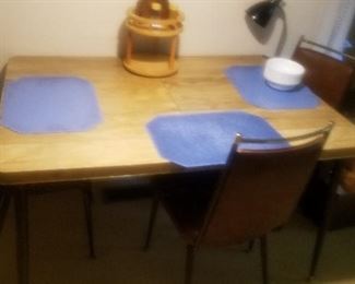 vintage table and chairs. there are 4 chairs