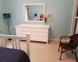 Matching White dresser, bed, mirror and cool contemporary floor lamp.
