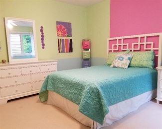 White dresser with mirror, decorator items, same bed.