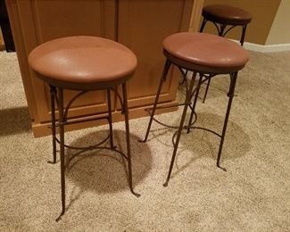 Leather covered seat bar stools.
