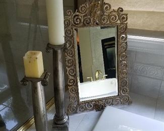 Decorative table top mirror and candle holders.