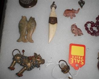boars tooth drop, jelly upal carved animals, and mire