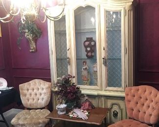 French country style china cabinet, little velvet side chairs. There are actually two of the little side table, flower arrangements