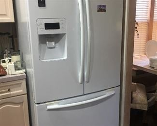 One of two white refrigerators available - this one is by Samsung and has bottom freezer