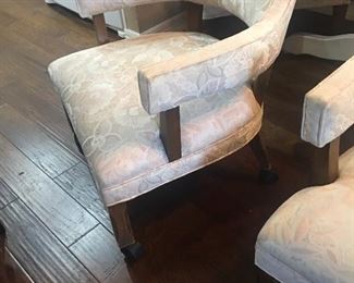 One of a set of 4 dining room chairs on casters. Upholstery is very clean, chairs are on casters and they are very comfortable .