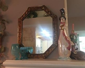 Goldleaf mirror, snowman and teal blue glassware.