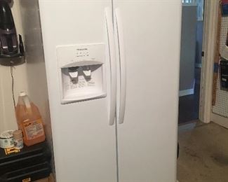 2nd white refrigerator. Thus one is by Frigidaire and is a double door side by side