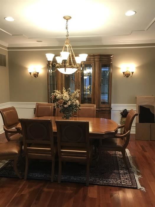  Bernhardt formal dining set, six side chairs, two arm chairs beautifully carved with leather seats and accents, with China cabinet, side server/buffet, Two leaves, and custom made Table top protectors. 