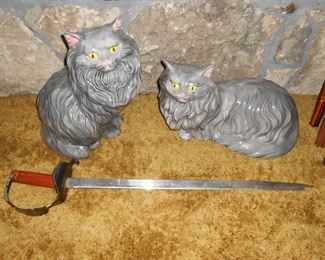 Peaceful ceramic cats.....and a sword