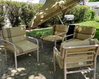 Outdoor umbrella & 4 chairs w/cushions. umbrella needs extension pipe and stand