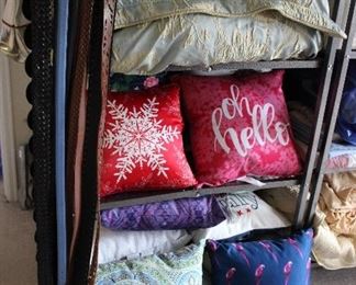 tons of linens and contemporary pillows