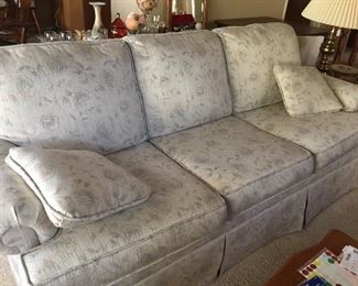 Well maintained, comfortable sofa with neutral fabric for any decor