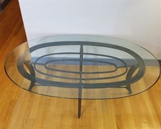 Oval glass top and metal coffee table   https://ctbids.com/#!/description/share/177956
