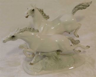 Pair of large vintage porcelain stallions, signed Hutschenreuther, Selb, Germany, Kunstabteilung,           16 1/2" long by 51/2" wide by 11 1/4" high