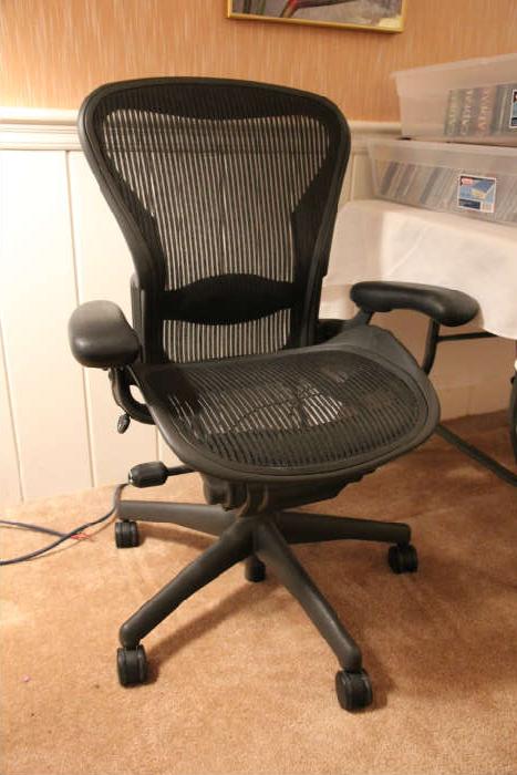 There are two Herman Miller Aeron chairs.