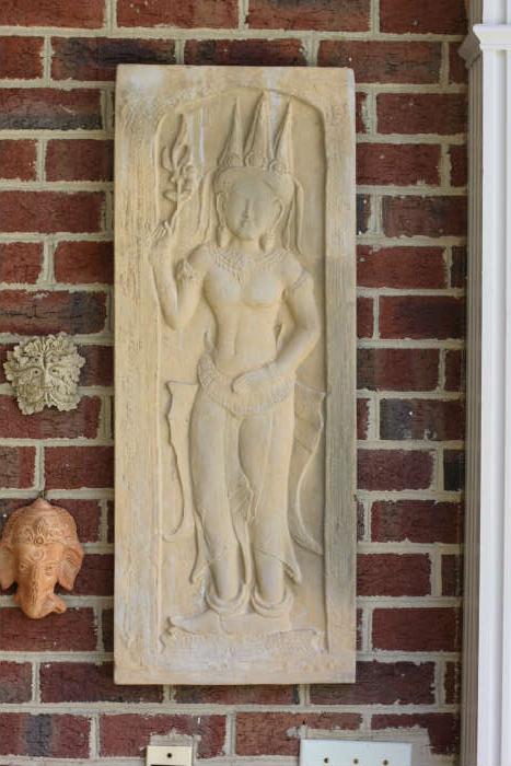 One of two garden wall plaques, purchased by the owner at the Louvre shop in the early 1960s.