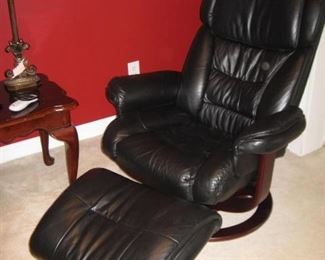 One of 2 Lane leather swivel recliners with ottomans