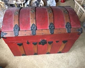 Red Trunk with Colored paper inside.