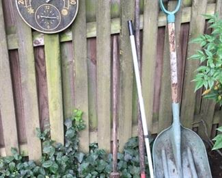Garden tools and  sun dial.