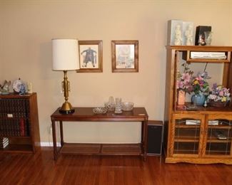 Bookcase, sofa table and cabinet.  