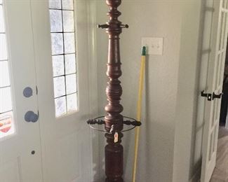 Antique barber shop coat & umbrella rack with rotating spindles. $2500