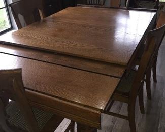 19th century Antique, oak extension dining table with carved and turned legs. $1100 with five chairs