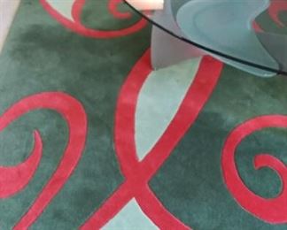 Beautiful wool rug in greens and cranberry