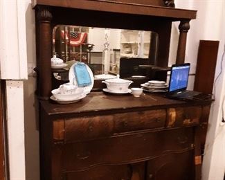 The most stunning piece in building! Late 1800s, made by SC furniture maker who enjoyed carving toenails on the claw foot bases! Dont let the need for a little veneer work make you pass this one up!