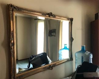 a large mirror that is definitely not reflecting a ghost