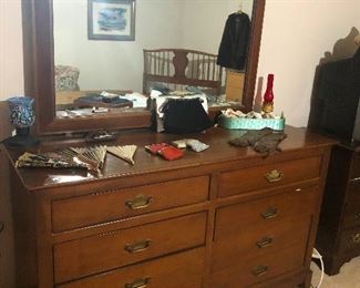 vintage dresser reflecting bright ghost of previous tenant