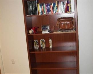 one of two bookcases, books, globe and more