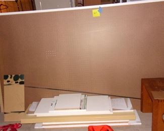 Large peg board and wood pieces.