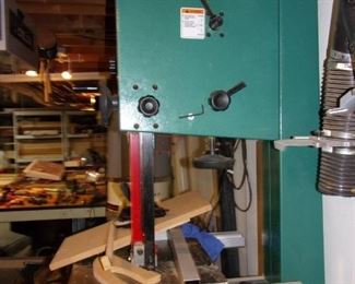 Grizzly is proud to offer this full-featured Extreme 17" Heavy-duty Bandsaw with cast-iron wheels. This 2 HP motor powers through wood with a maximum cutting capacity of 12" height and a 16-1/4" throat which is plenty for most applications. Features like the deluxe fence, extra-wide cast-iron table, heavy-duty miter gauge, dual 4" dust ports, micro-adjusting geared table, and double ball-bearing blade guides are usually found on machines costing much more. And, the ISO 9001 factory designation assures high quality standards