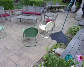 Teak patio set (table and chairs, love seat/bench, two arm chairs, 2 end tables and coffee table) and vintage metal rocker chairs (3).